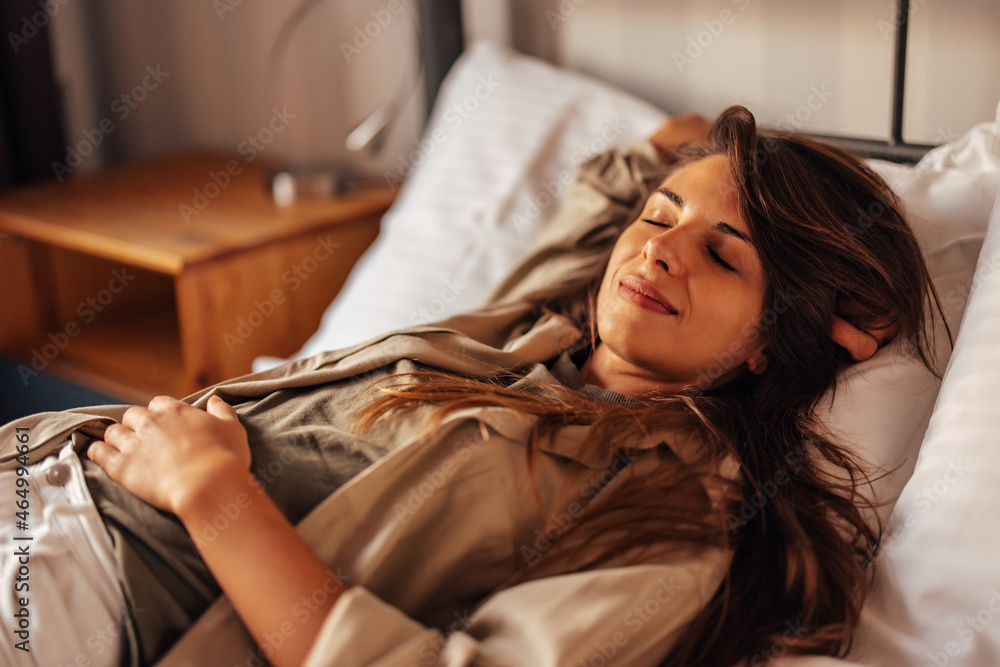 Adult woman, recharging her energy by sleeping.