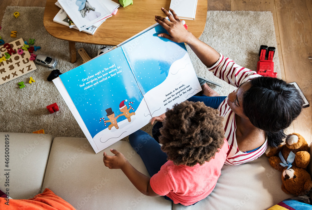 Mom reading picture book with her son