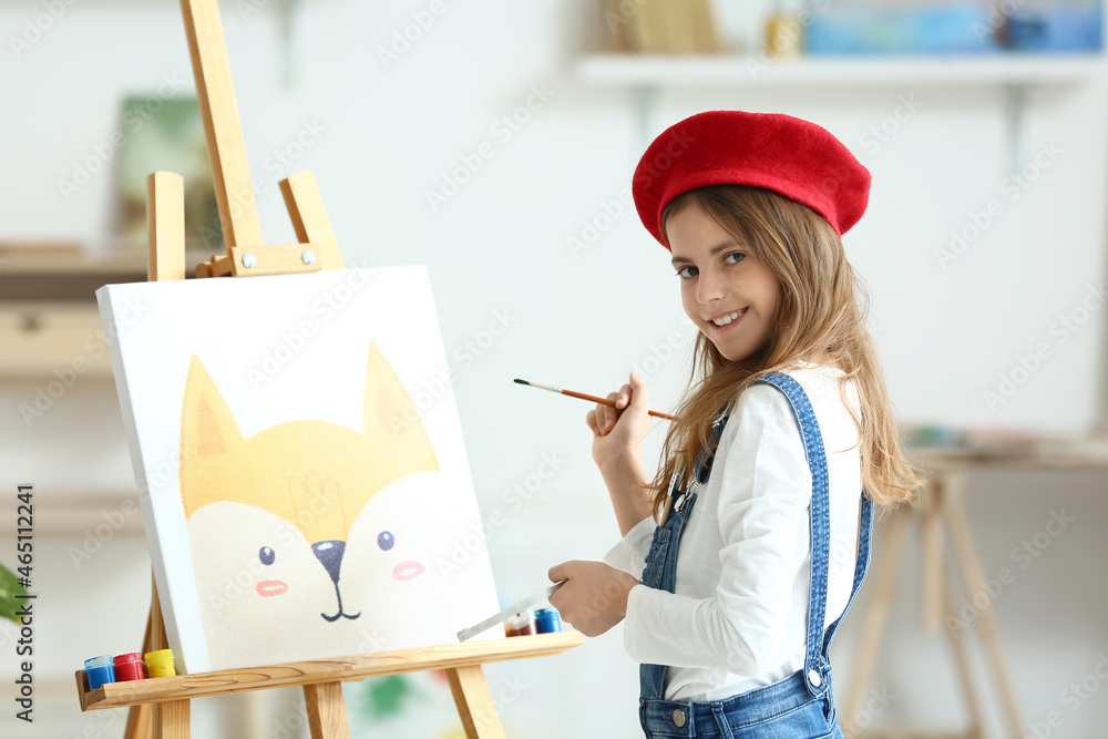 Cute little girl painting at home