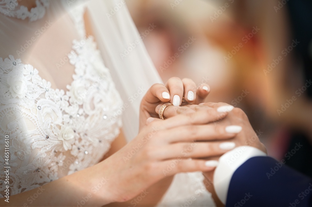 A bride and groom exchanging of the Wedding Rings during wedding ceremony