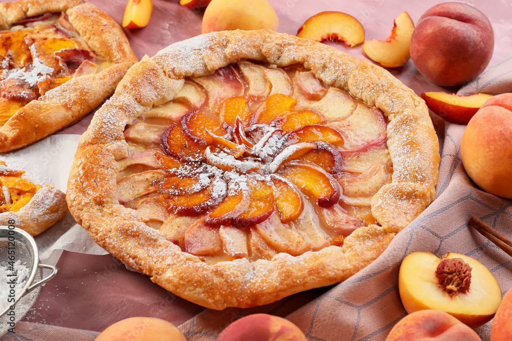 Tasty peach galette on table, closeup