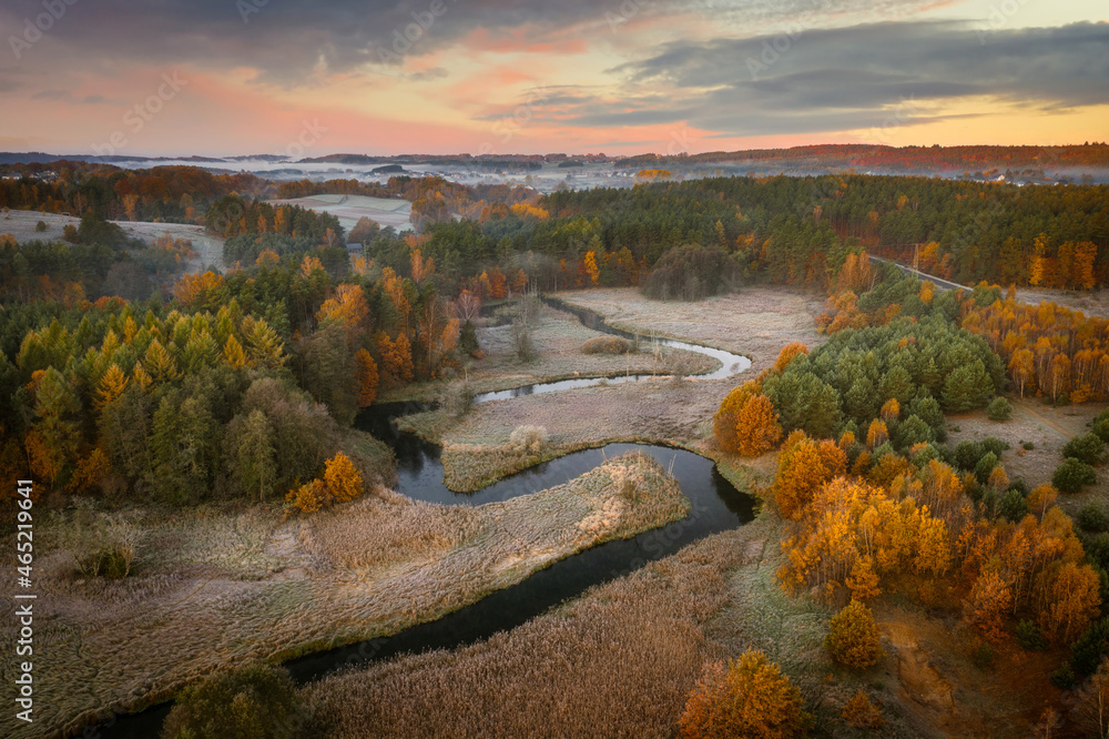 Misty landscape of Kashubian rivers and forests at sunrise. Poland