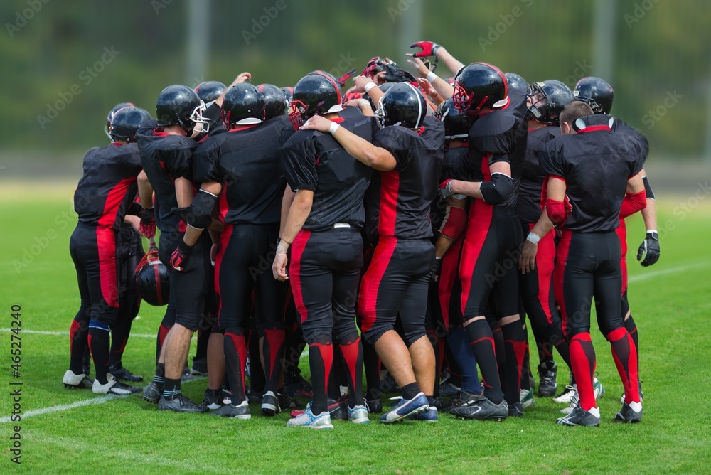 American Football Players Discussing Strategy