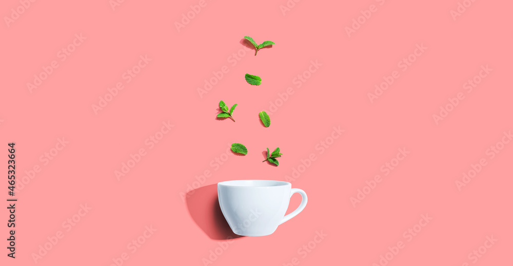 Fresh mints with tea cup overhead view - flat lay