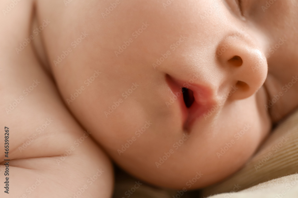 Little baby sleeping on bed, closeup