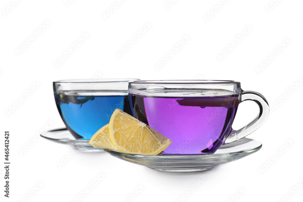 Cups of butterfly pea flower tea on white background