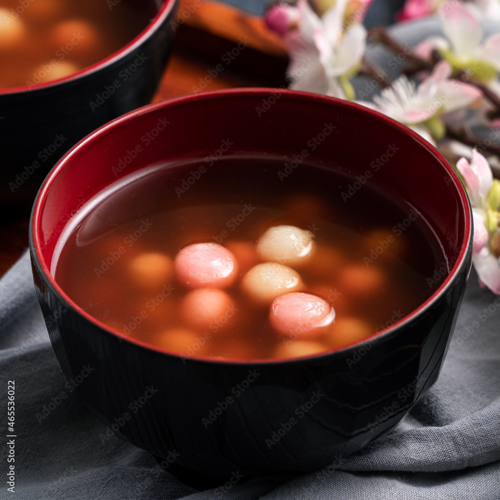 Red and white tangyuan with syrup soup.