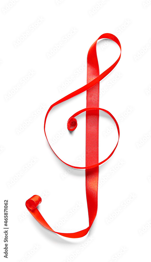 Violin clef made of red ribbon on white background