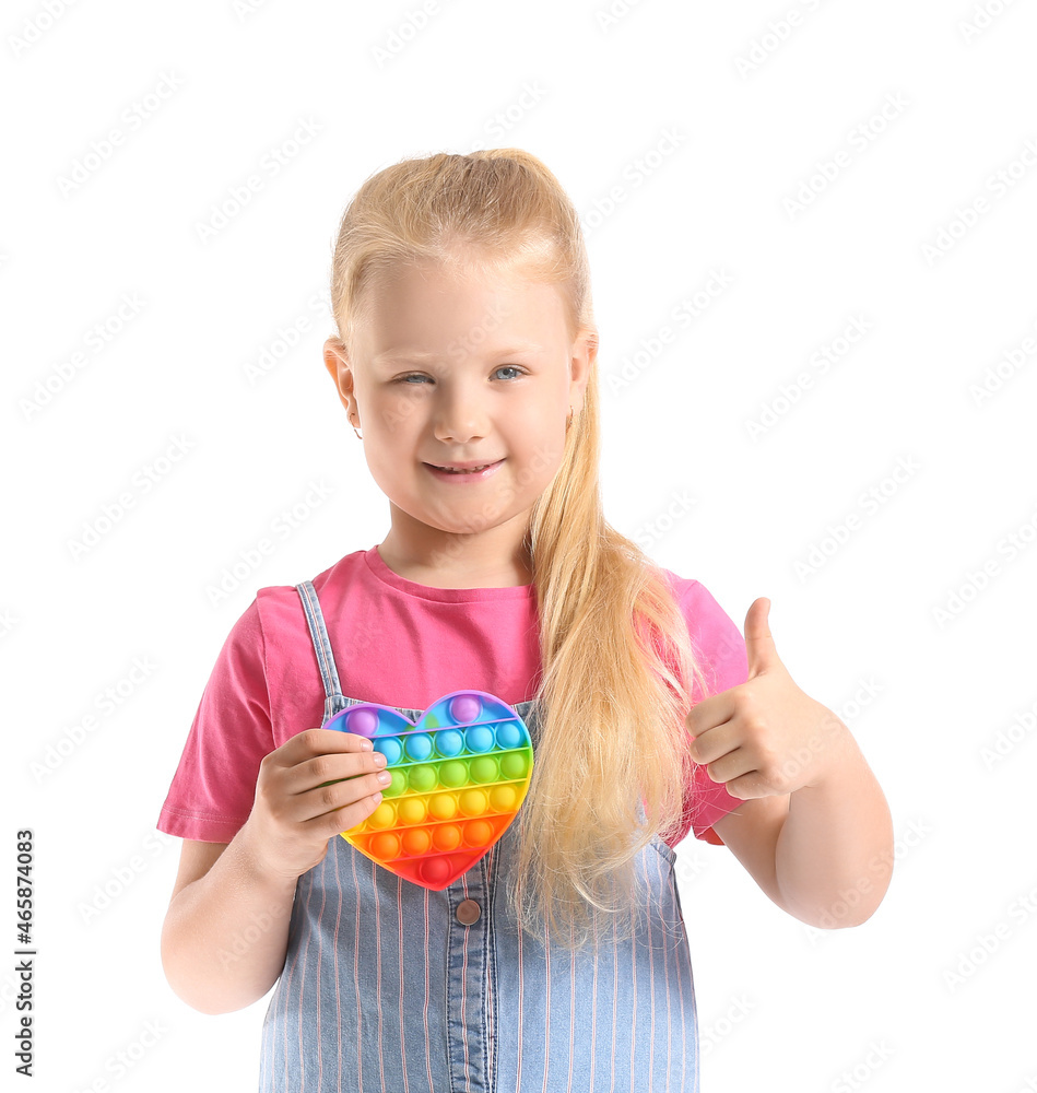 Pretty girl holding pop it fidget toy and showing thumb-up on white background