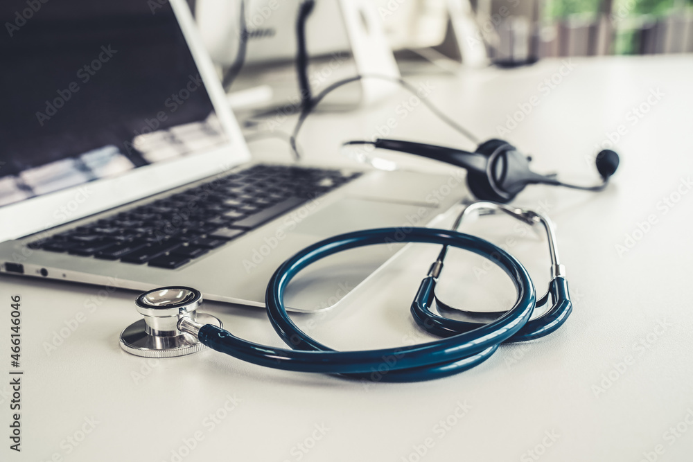 Headset and doctor equipment at clinic ready for actively support for patient by online video call .