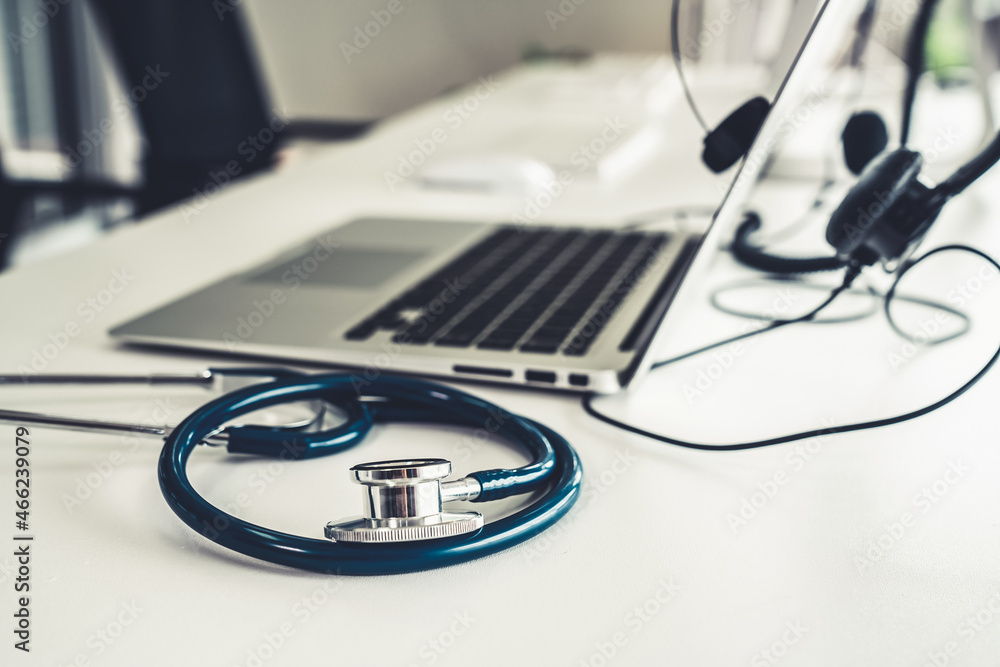 Headset and doctor equipment at clinic ready for actively support for patient by online video call .