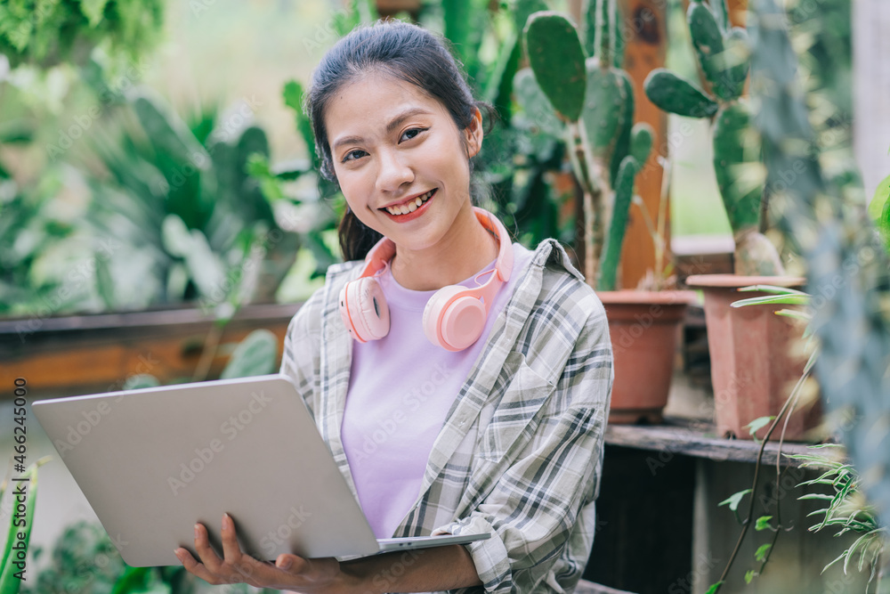 Young Asian woman working in the garden