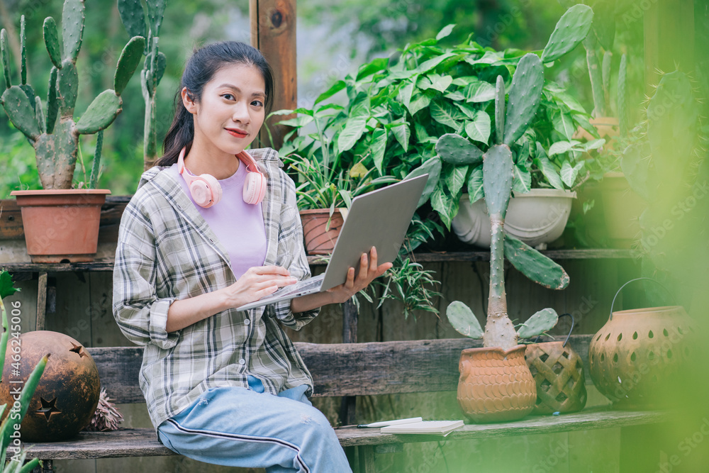 Young Asian woman working in the garden