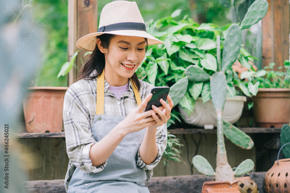 Young Asian woman takes care of the garden