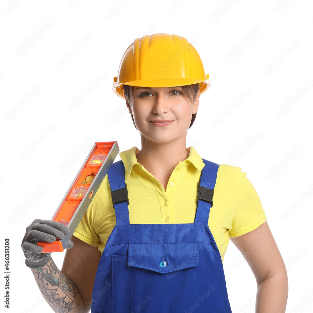 Female construction worker in hardhat with builder level on white background