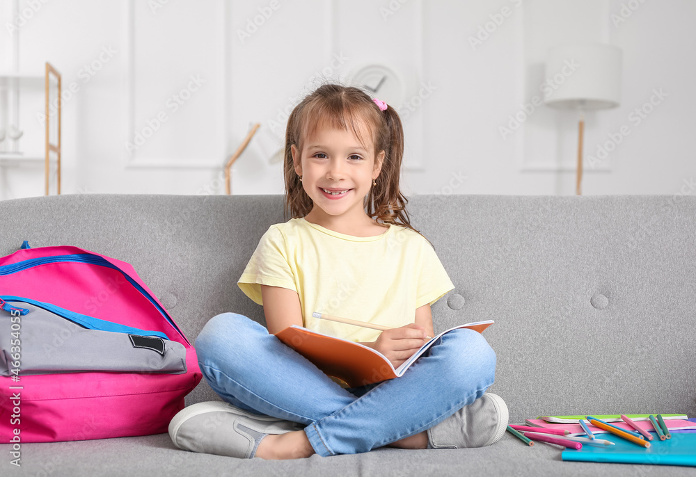 Little girl doing her lessons at home