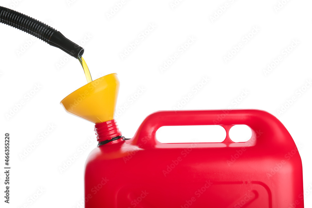 Pouring of motor oil in canister against white background, closeup