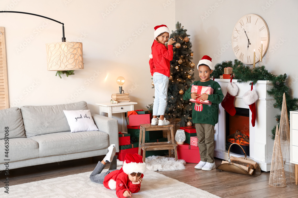 Cute little children at home on Christmas eve