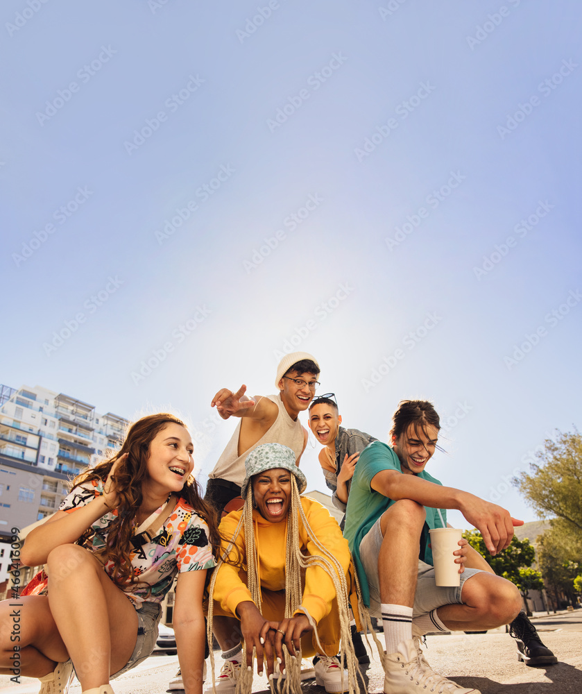 Diverse group of friends having fun in the city