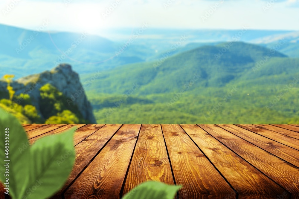 table background and blurred landscape of mountains.