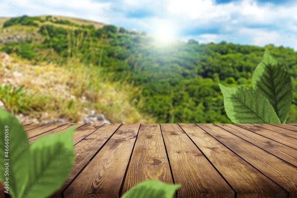 table background and blurred landscape of mountains.