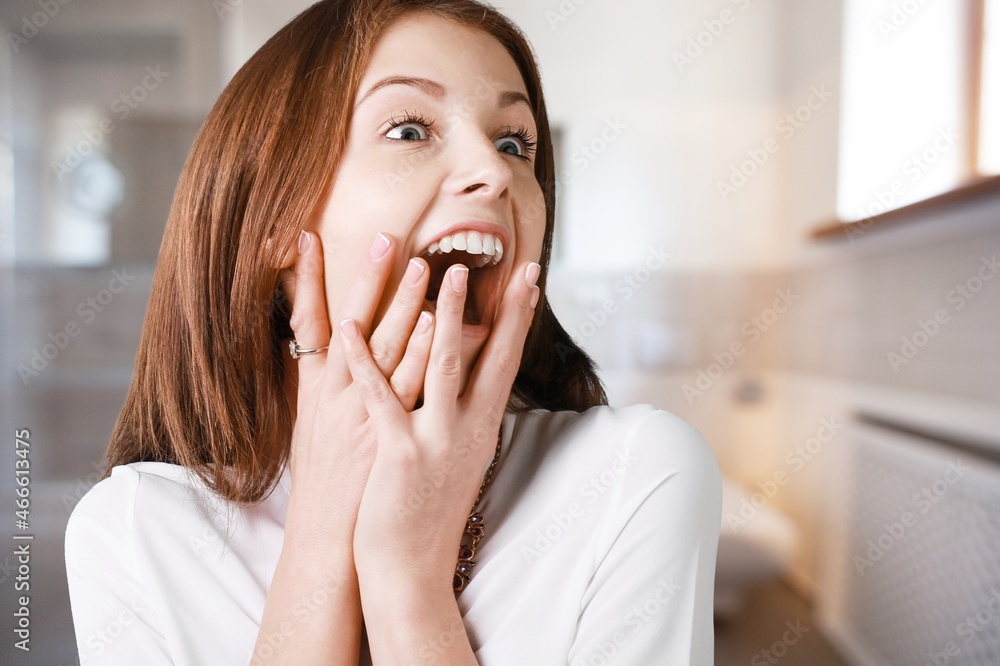 Happy satisfied young woman relaxing at home. Successful woman