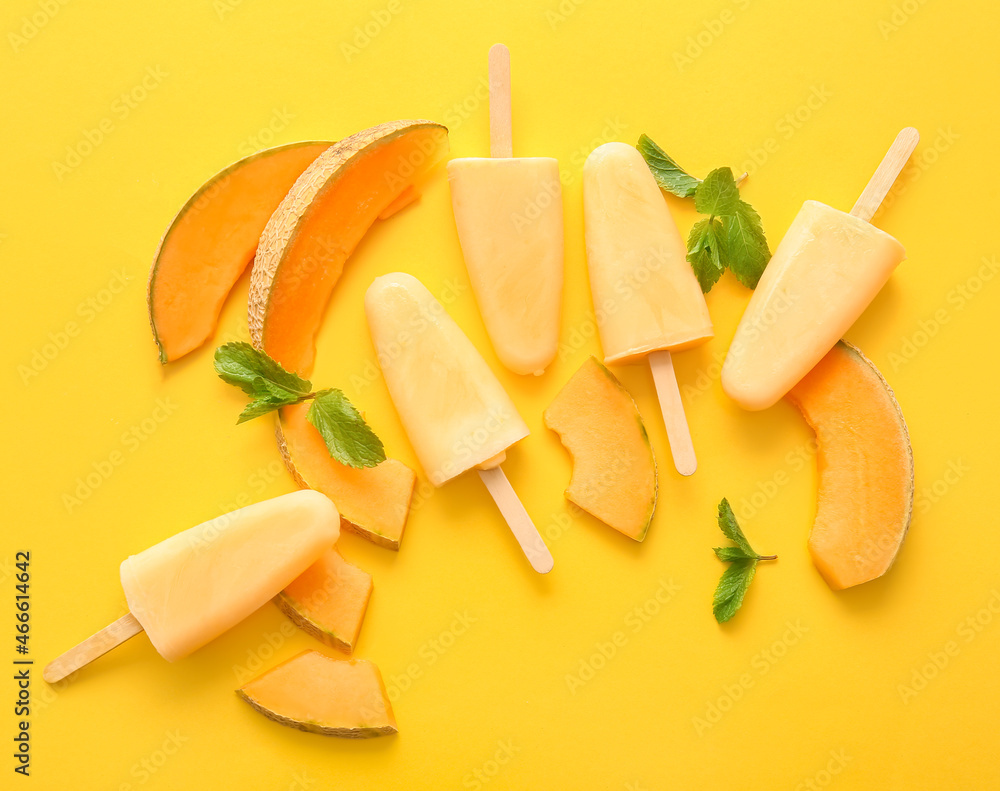 Tasty melon popsicles on color background