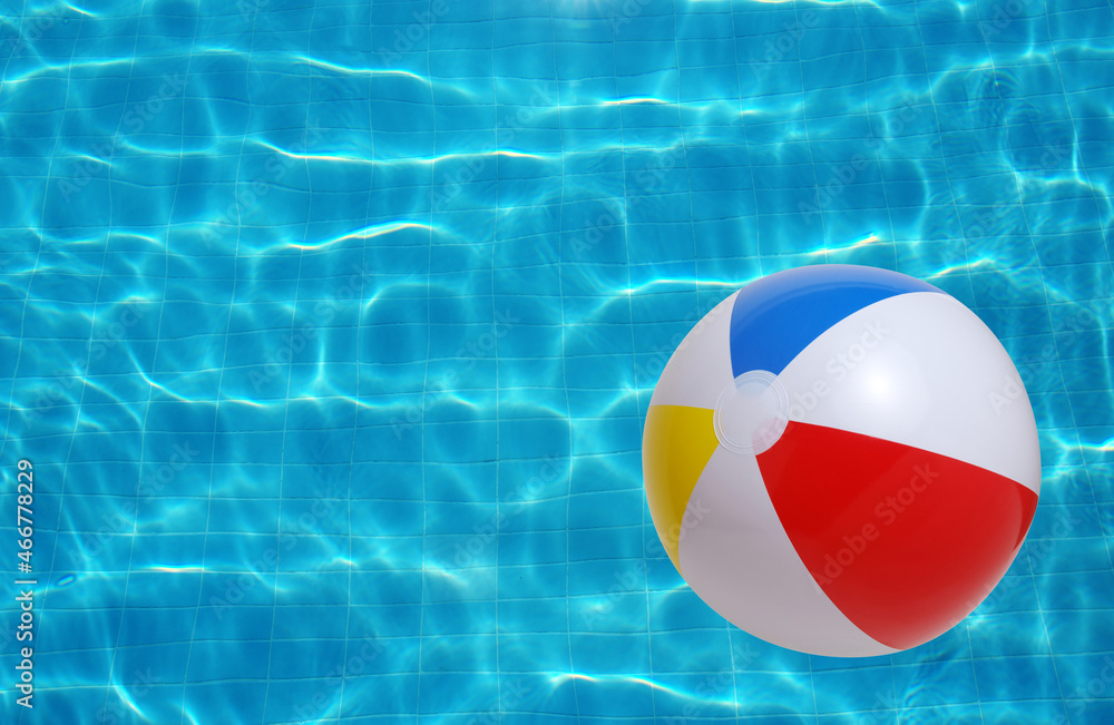 Swimming pool water and beach ball