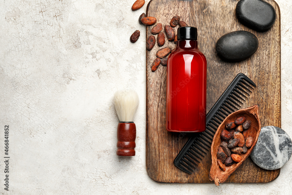 Composition with bath supplies and cocoa beans on light background