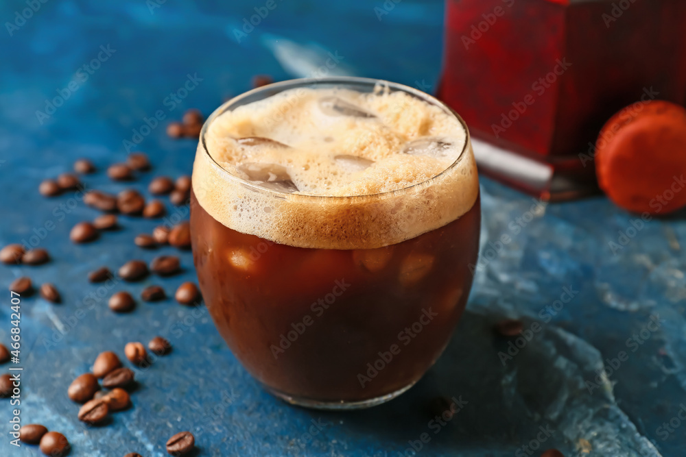 Glass of tasty iced coffee on color background