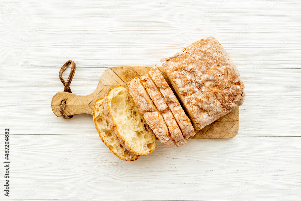 Cutting bead top view. Loaf of bread on bakery table