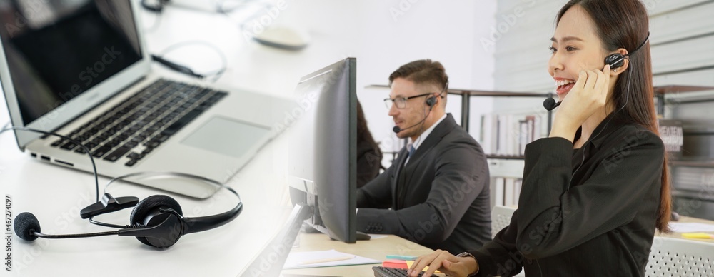 Business people wearing headset working in office to support remote customer or colleague. Call cent