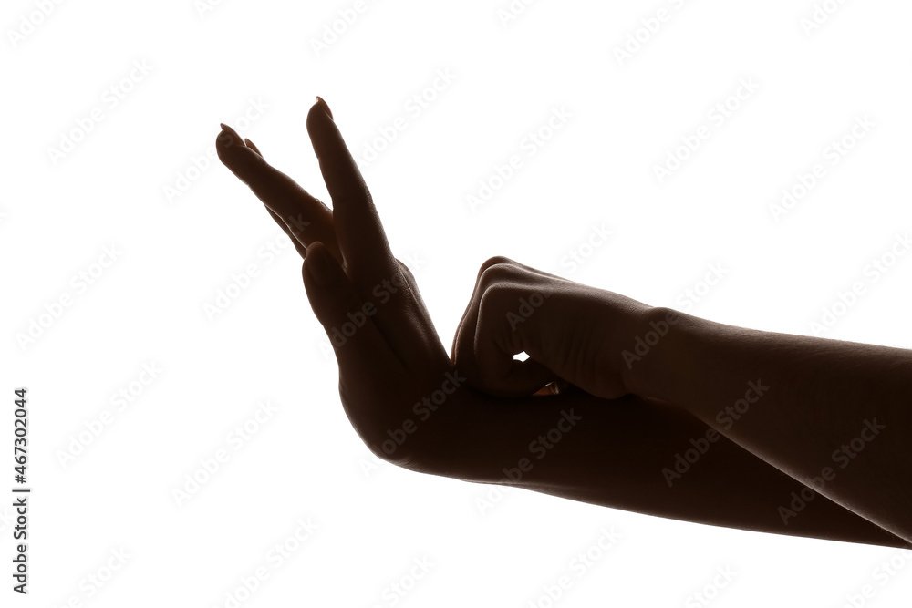 Woman making shadow snail with her hands on white background