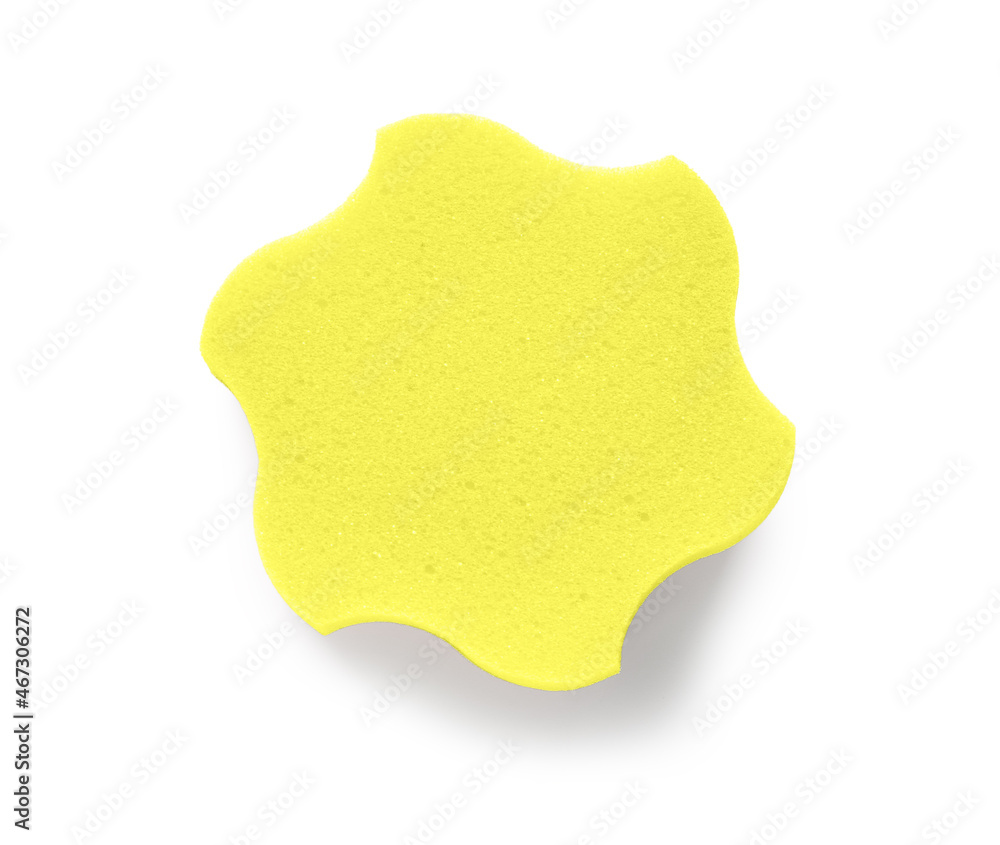 Yellow star shaped bath sponge on white background