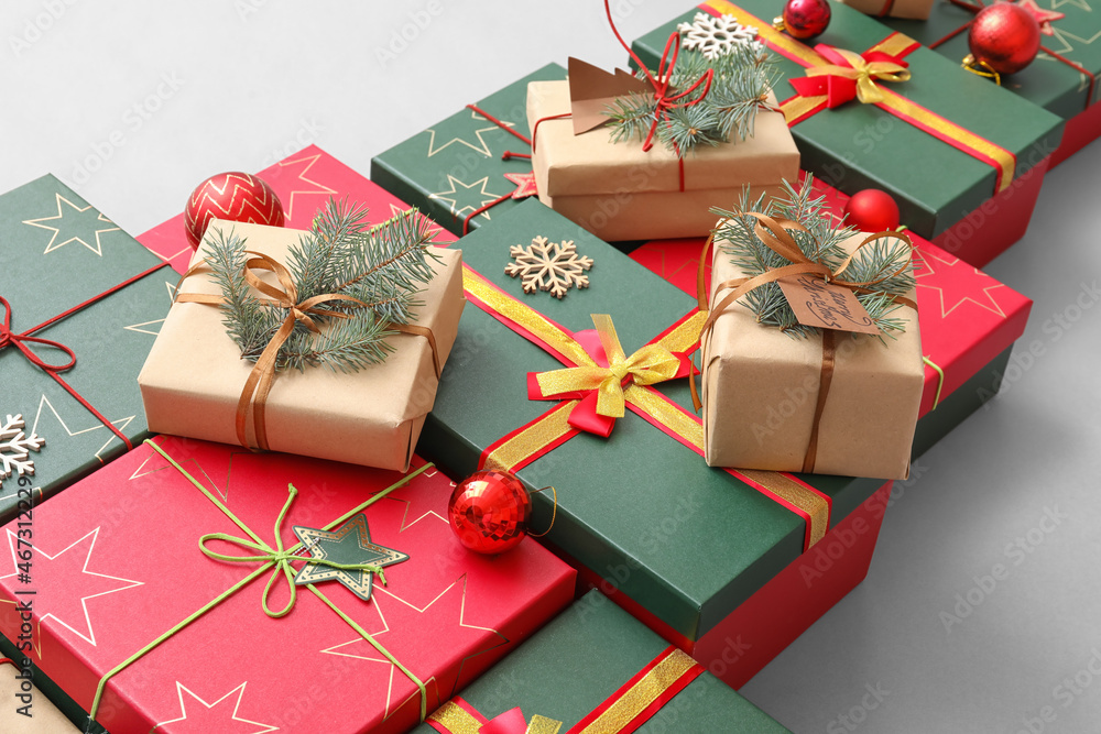 Christmas tree made of presents on light background