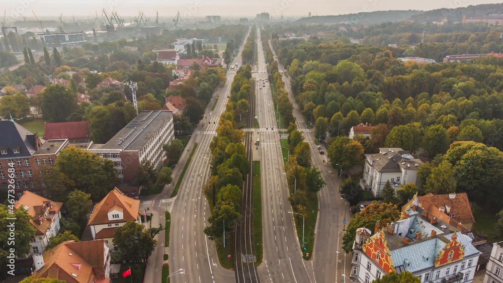 The main road leading to Gdańsk from Wrzeszcz. Green alley with beautiful linden trees. Poland.
