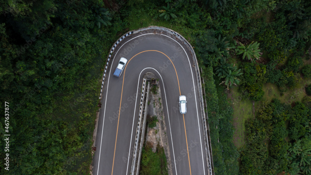 Aerial view asphalt road in mountain pass with green forest, Countryside road passing through the gr