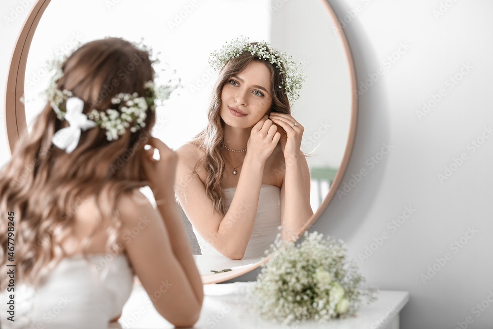 Beautiful young bride preparing for her wedding day