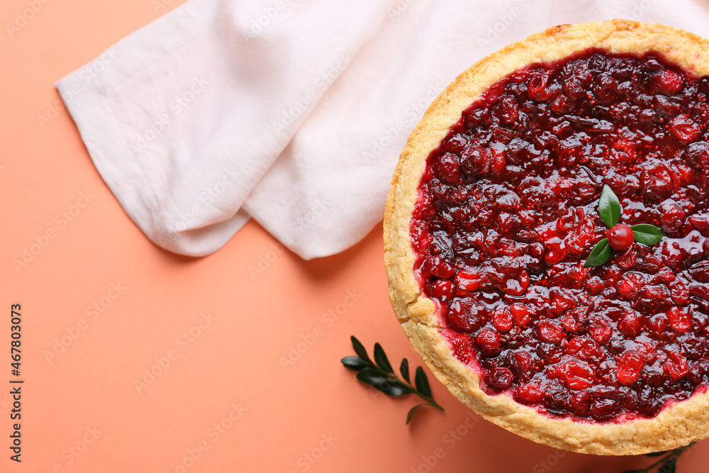 Tasty homemade lingonberry pie on color background