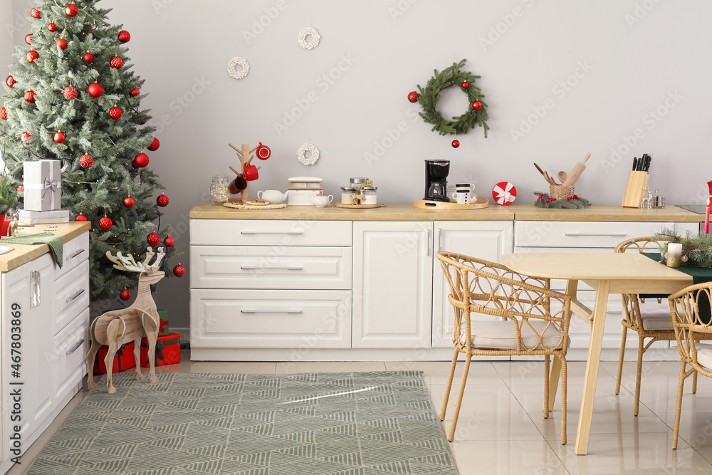 Interior of light kitchen decorated for Christmas