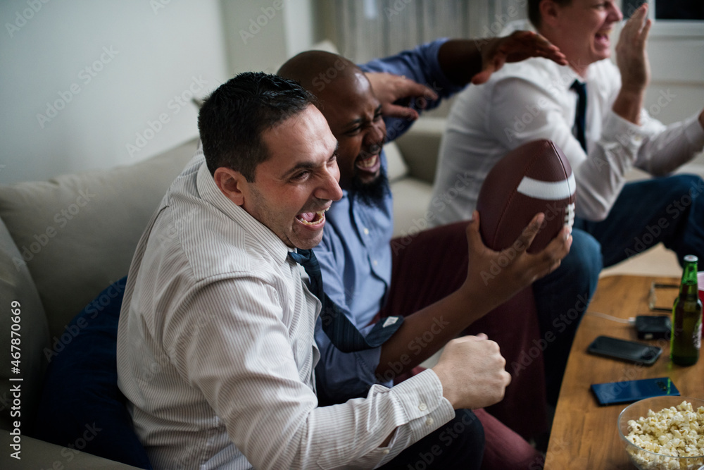 Friends cheering sport league together