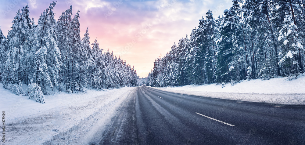 Beautiful view of the snowy curve country road in winter