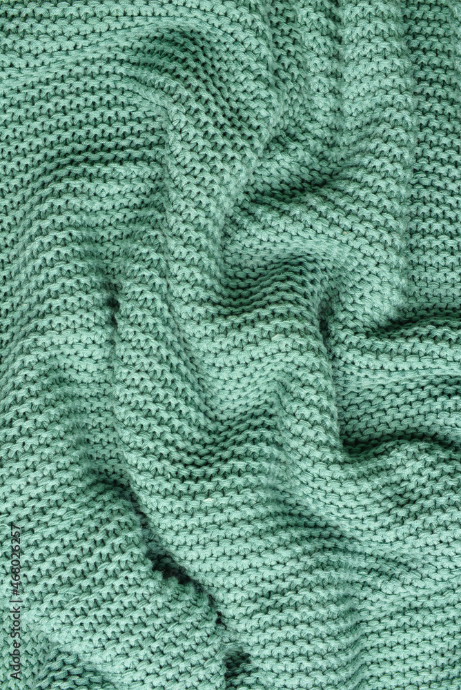 Texture of crumpled knitted fabric as background