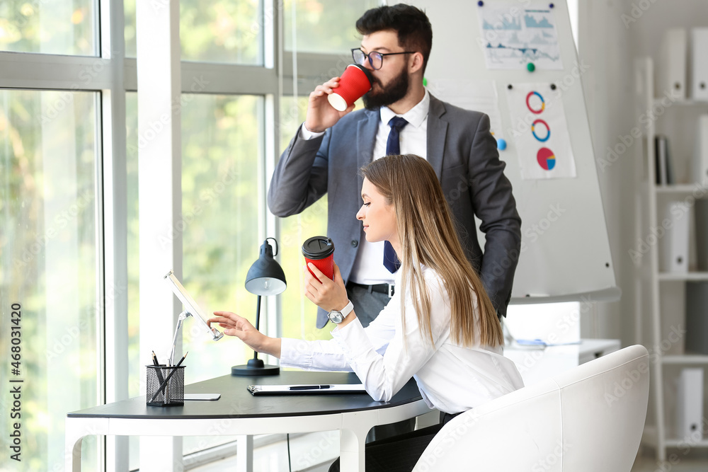 Business people having coffee break in office