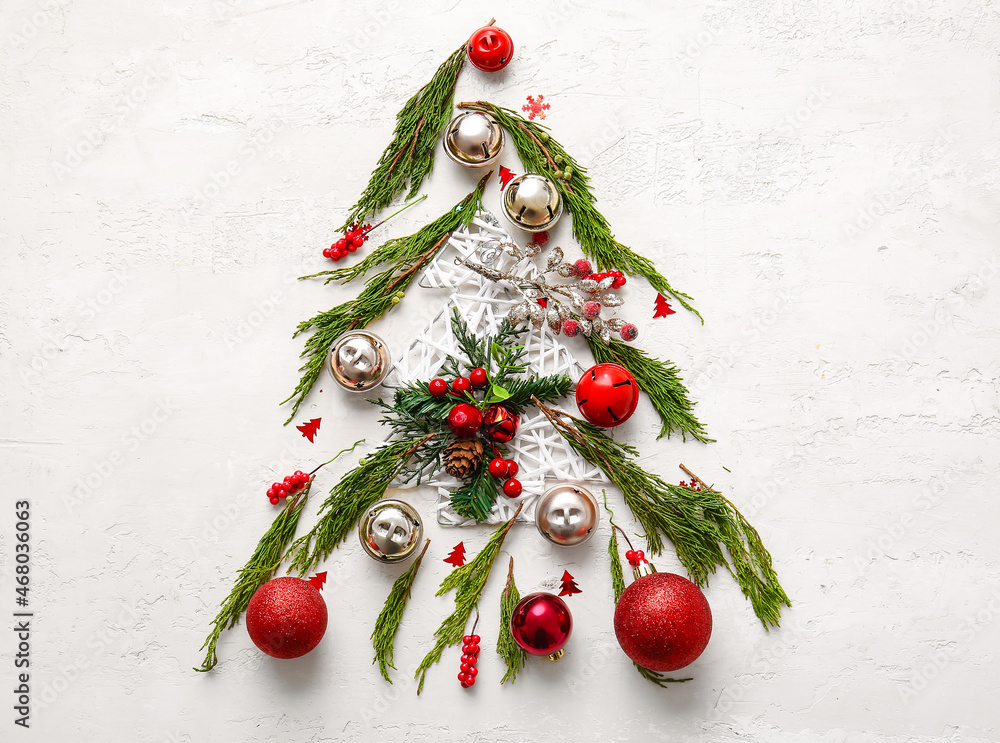 Tree made of coniferous branches and Christmas decor on white background