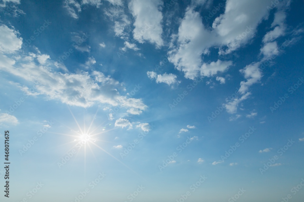 Blue Sky with Sun Shining and Clouds