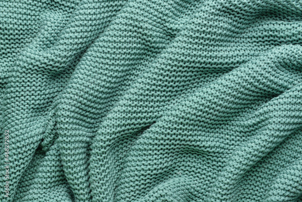 Texture of crumpled knitted fabric as background