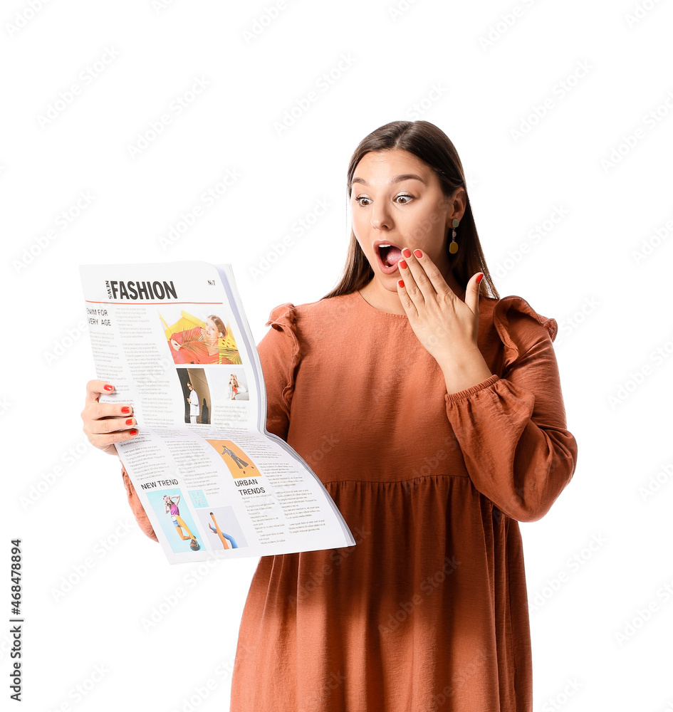 Surprised beautiful woman reading newspaper on white background