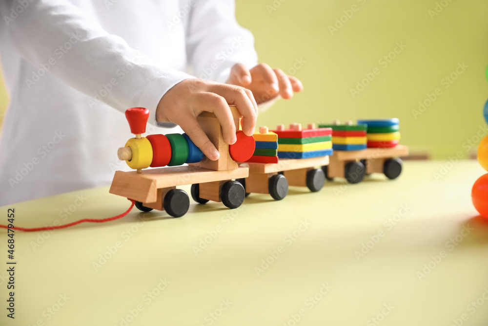 Cute baby girl playing at home, closeup