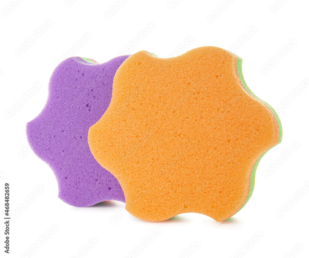 Purple and orange star shaped sponges on white background